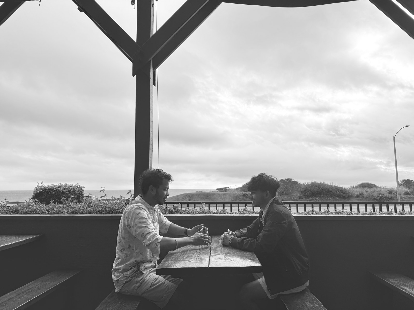 Conversation across a table by the water